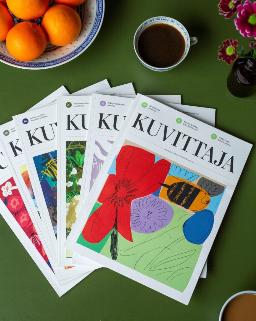 Kuvittaja-lehtiä pöydällä, päällimmäinen kuvitus: Antti Kalevi